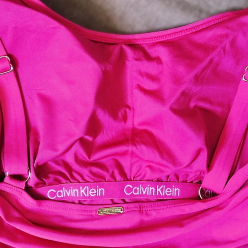 Calvin Klein one-piece swimsuit new, size 12, fuchsia with gold details