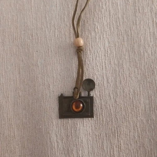 Vintage necklace with camera design used, wooden bead and amber stone