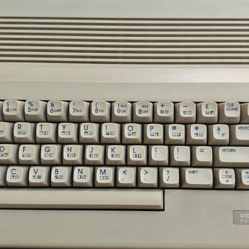 Commodore C64c personal computer with joystick and accessories