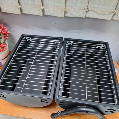 Portable grill with two cooking surfaces new