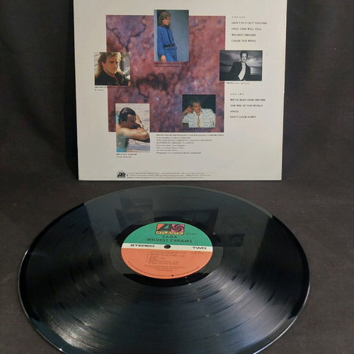 Saga Wildest Dreams vinyl used, rock with insert X8