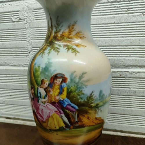 Old porcelain vase used, hand-painted with romantic scene