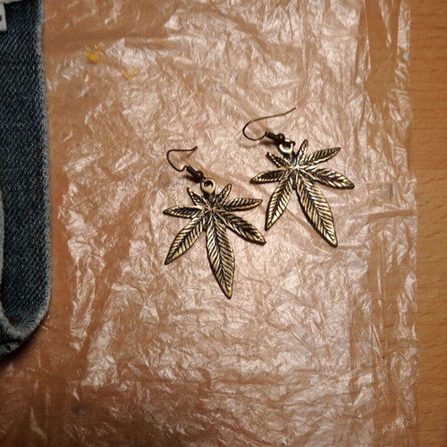 Marijuana dangle earrings unused