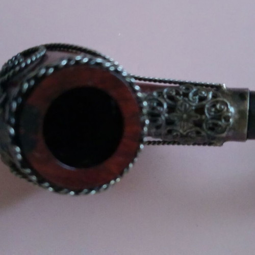Wooden pipe with intricate silver decoration used