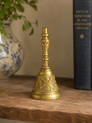 Vintage brass handbell with Dutch windmill relief, like new