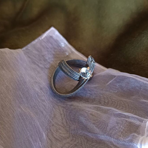 Handmade ring of oxidized silver with white topaz like new