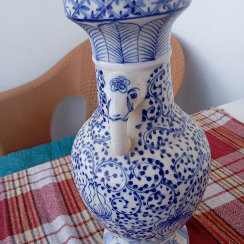 Vintage porcelain vase used, traditional Asian style blue and white Ming Qing design
