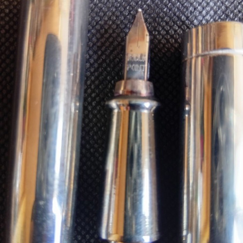 Parafernalia pen used, metal chrome finish, 1980s design