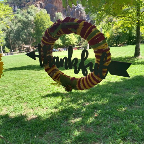 Handmade autumn decorative wreath with wooden thankful sign