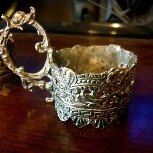 Vintage glass holders used with ornate design