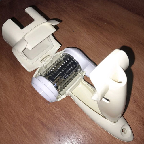 Hand-held grater new with plastic casing and inox wheel