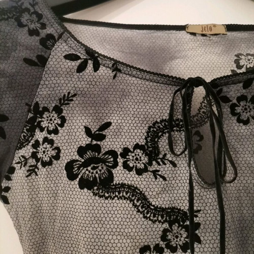 Women's blouse used, grey with black patterns, size M