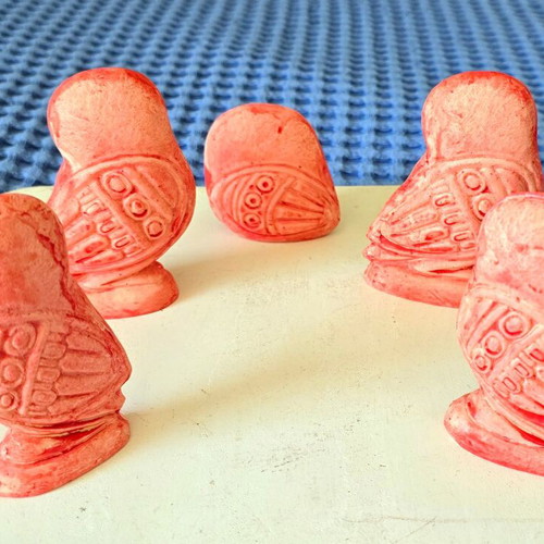 Set of five salmon pink owl figurines