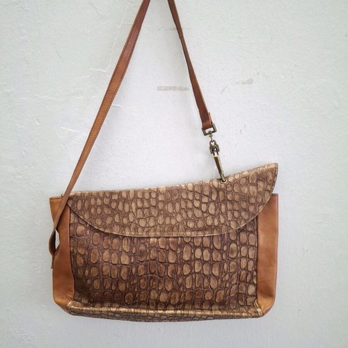 Vintage cowboy leather shoulder bag with metal accents like new