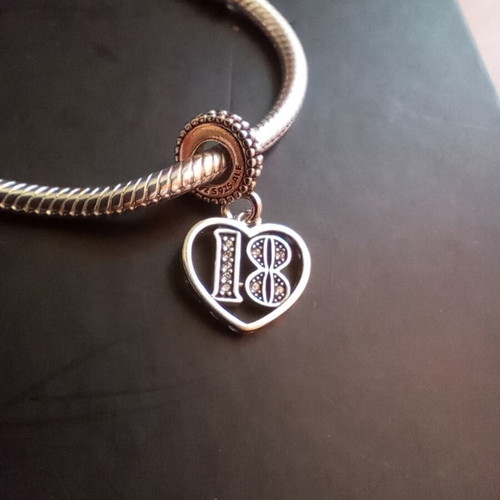 Pandora charm 18 years old, like new, silver