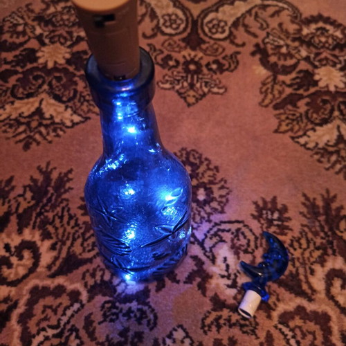 Bottle with LED light like new, blue and red