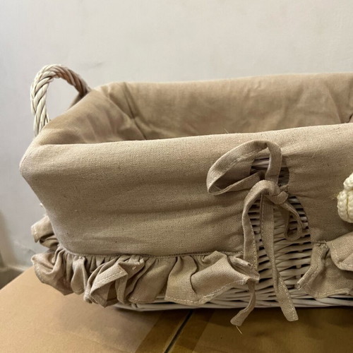 Wicker basket new with linen fabric lining and handmade knitted flower