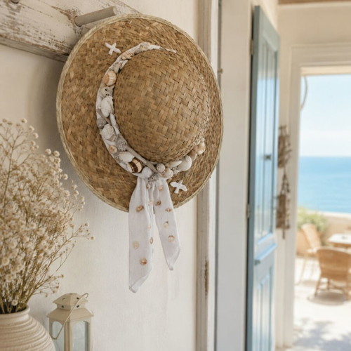 Decorative straw hat like new, summer decoration with plaster and shells