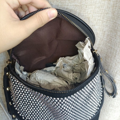 Black crossbody bag with embossed silver rhinestones