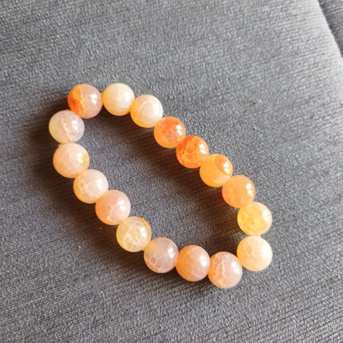 Bracelet with orange beads elastic, like new