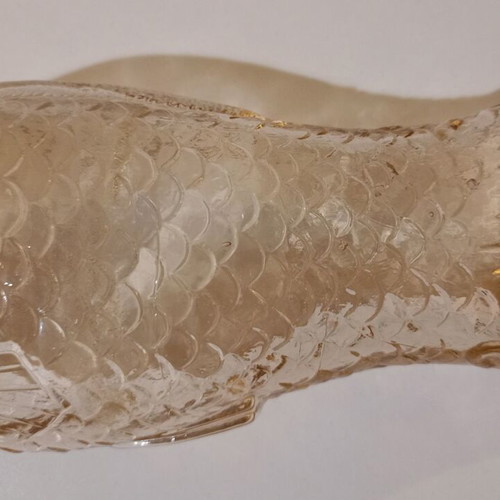 Glass bottle in fish shape used