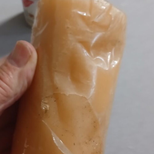 Set of 2 new candles, one with small dent