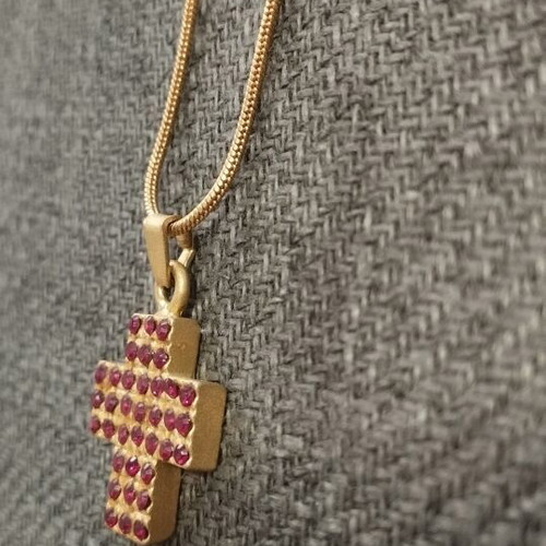 Necklace with gold color cross pendant and red rhinestones like new