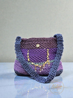 Handmade knitted shoulder bag in purple shades with gold details