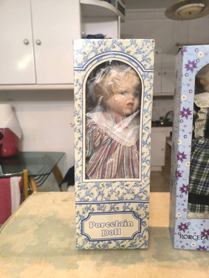 Vintage porcelain doll in box new