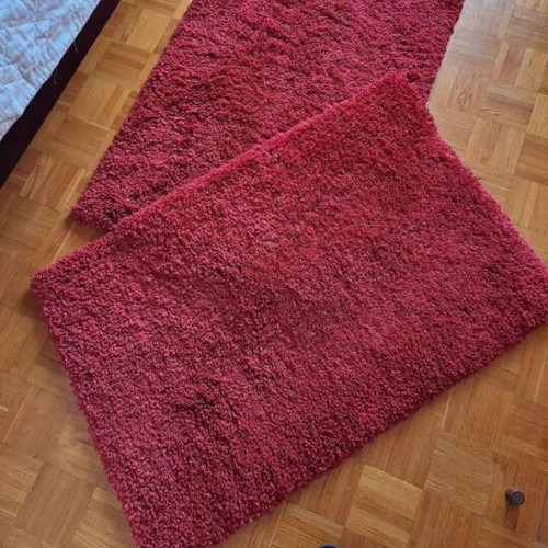 Shaggy red rugs with high pile, 2 rectangular and 1 round