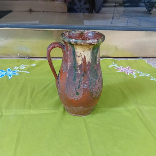 Ceramic jug used, antique style with cream and green glaze