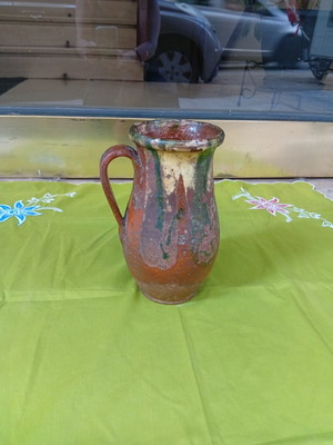 Ceramic jug used, antique style with cream and green glaze
