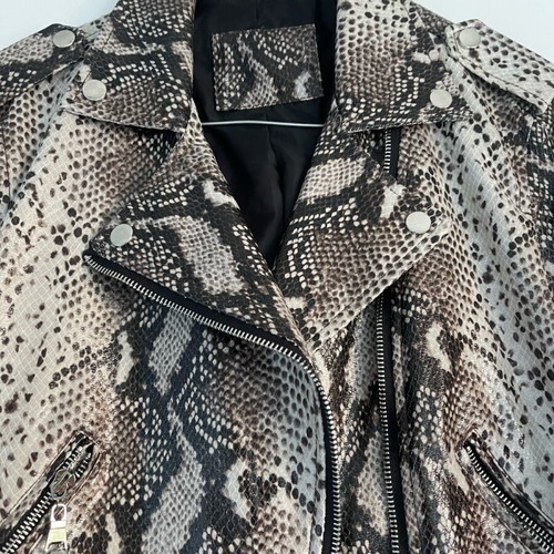 Please short leatherette jacket small like new, beige brown