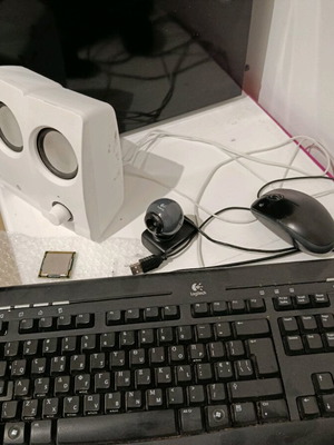 Desktop computer with speakers, keyboard, and camera used