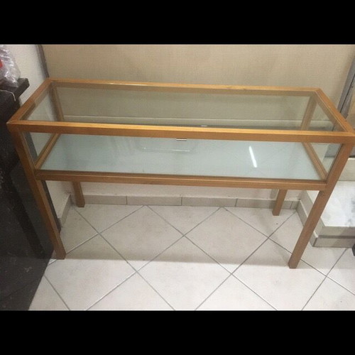 Console used with wooden frame and glass surfaces