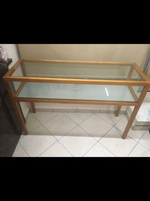 Console used with wooden frame and glass surfaces