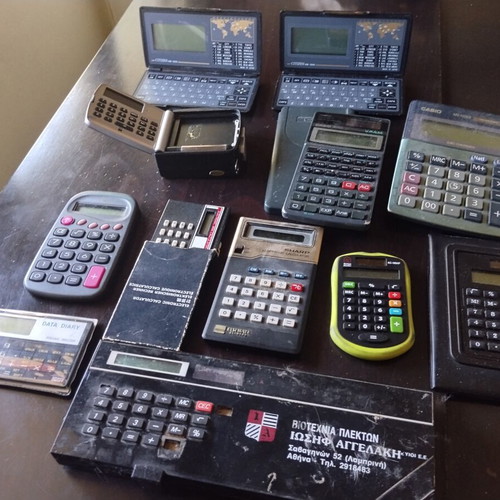 Vintage calculators and electronic organizers used, pack of 12