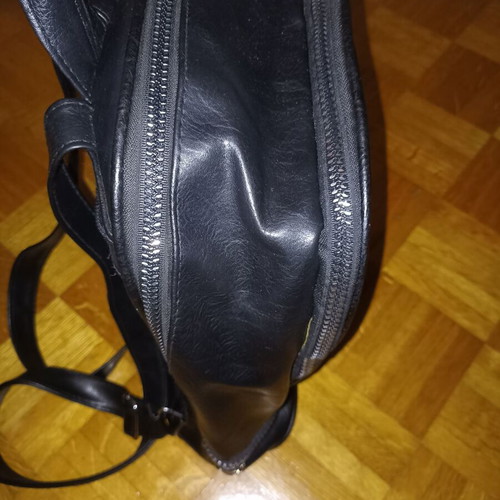Backpack black leather type used with multiple pockets