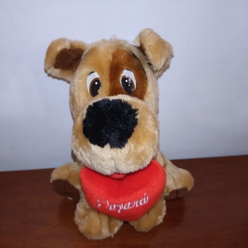 Plush dog used with red heart