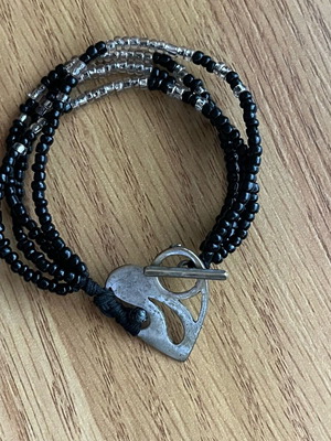 Bracelet like new with silver heart clasp and black beads