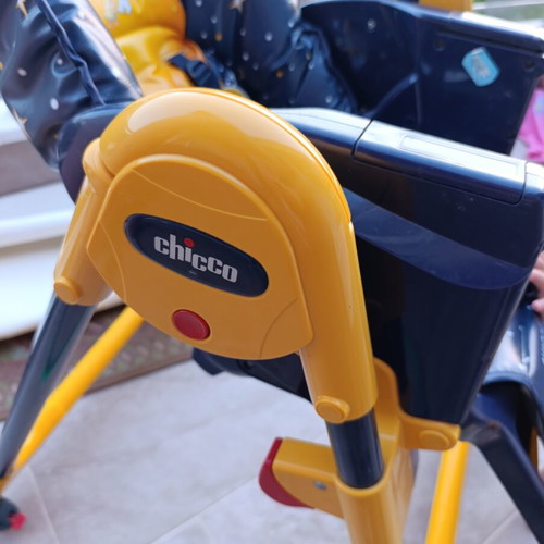 High chair used with plastic tear and stickers