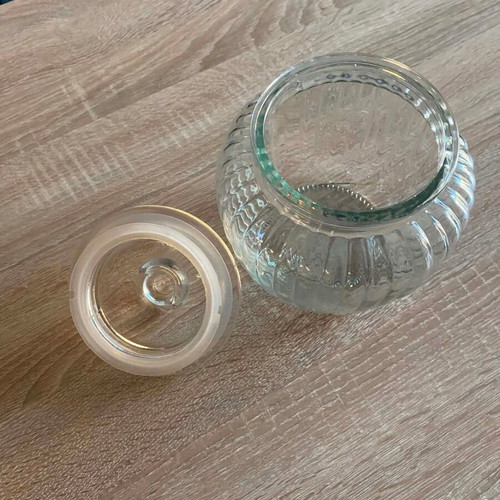 Glass Airtight Storage Jar like new, embossed design, 11.5cm height
