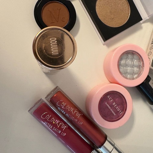Various cosmetics like new, Colourpop liquid lipsticks and eyeshadows