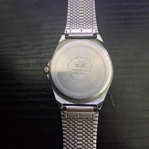 Q&Q Quartz men's watch used, silver with black dial
