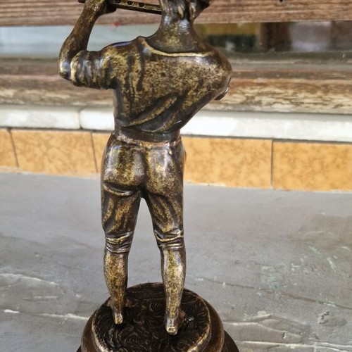 Vintage bronze sculpture of a boy playing flute used