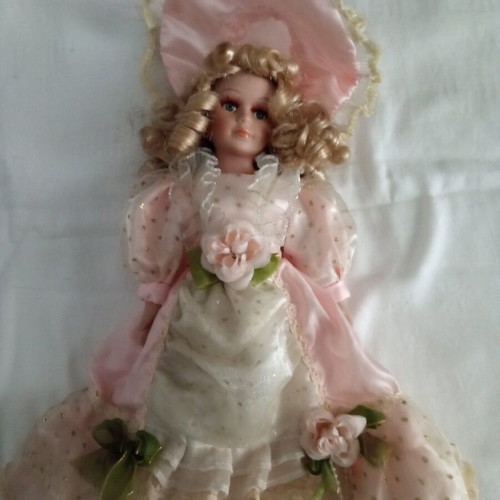 Porcelain collectible doll with base like new, 33 centimeters