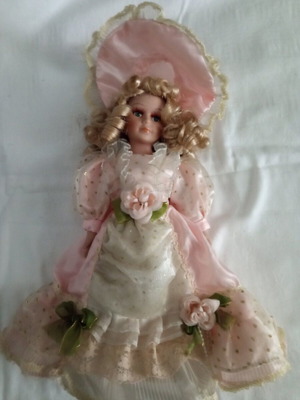 Porcelain collectible doll with base like new, 33 centimeters
