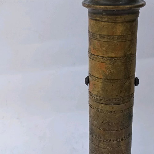 Brass prewar coffee grinder with engraved designs