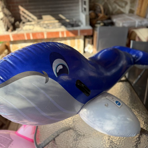 Inflatable dolphin float, blue, with side handles
