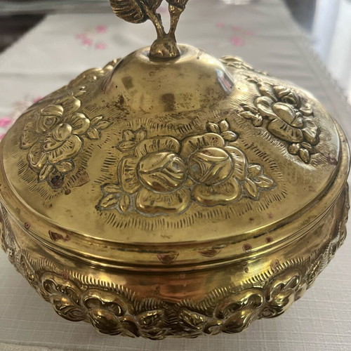 Vintage brass jewelry box used with embossed floral motifs